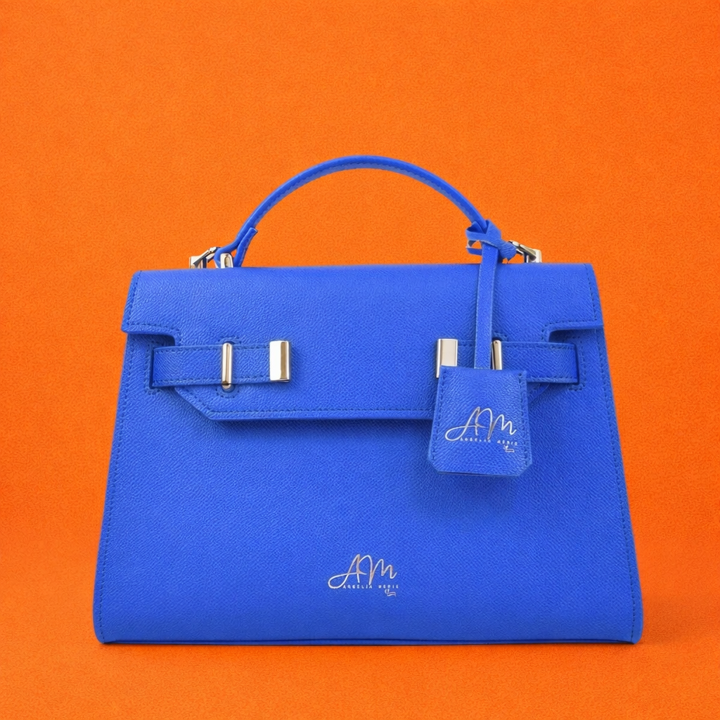 Blue Dream Lux handbag on a vivid orange backdrop